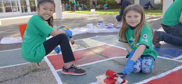 Girls smiling and painting