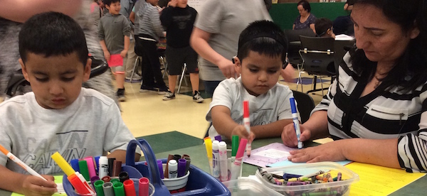 Parent and students coloring together