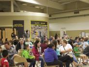 Parents and students gather for the groundbreaking ceremony