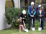 Superintendent Linda Florence enlists the help of a Sweetbriar student to get the shovels in the ground