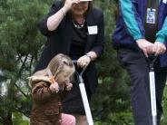 Superintendent Linda Florence enlists the help of a Sweetbriar student to get the shovels in the ground