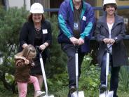 Superintendent Linda Florence enlists the help of a Sweetbriar student to get the shovels in the ground