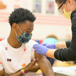 teenage boy being vaccinated
