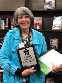 Susan Bowker with award