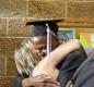 Reynolds Learning Academy Graduate hugs guest after ceremony