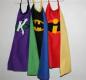 Superhero capes hanging on a hook